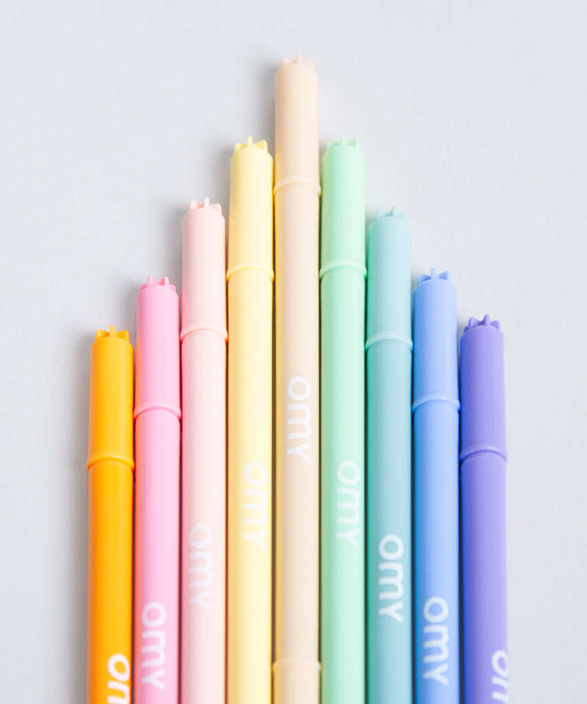 OMY   Assortment of 9 pastel markers. Trendy markers with soft and prominent colors! 9 unreleased colors that spark new nuances through coloring and drawing. Conveniently, the box transforms into an at home crayon holder! Made in Italy  Content 9 ultra washable pastel felt pens Made in Italy and designed in France by OMY