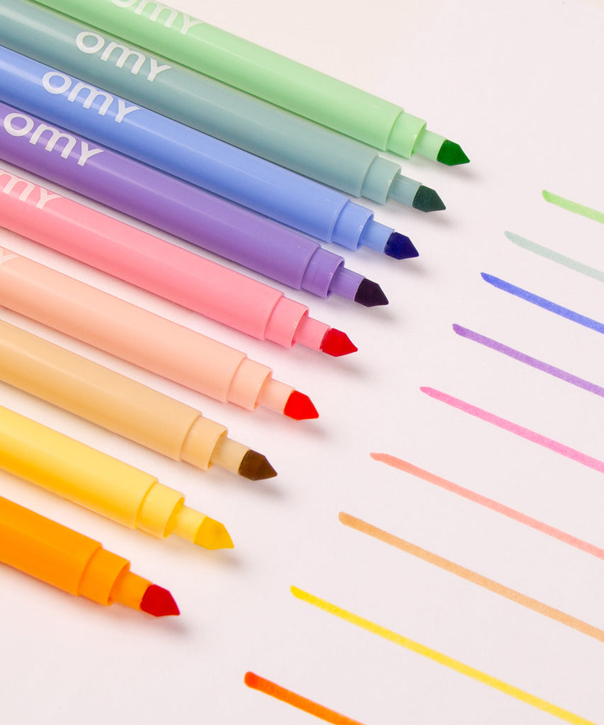 OMY   Assortment of 9 pastel markers. Trendy markers with soft and prominent colors! 9 unreleased colors that spark new nuances through coloring and drawing. Conveniently, the box transforms into an at home crayon holder! Made in Italy  Content 9 ultra washable pastel felt pens Made in Italy and designed in France by OMY