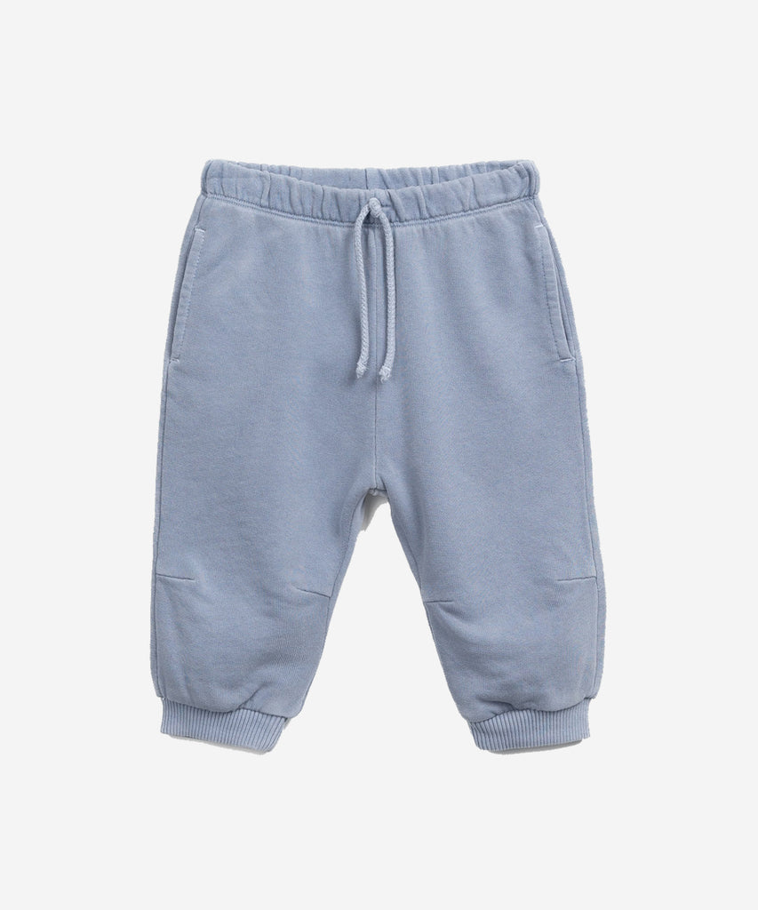 Details: These jersey-stitch trouser are made of a mixture of organic cotton and cotton, Sea colour. This model has an elastic waist and decorative drawstring, front pockets and elastic hems.  Colour: Sea blue  Composition:  70.0% Organic Cotton,30.0% Cotton  