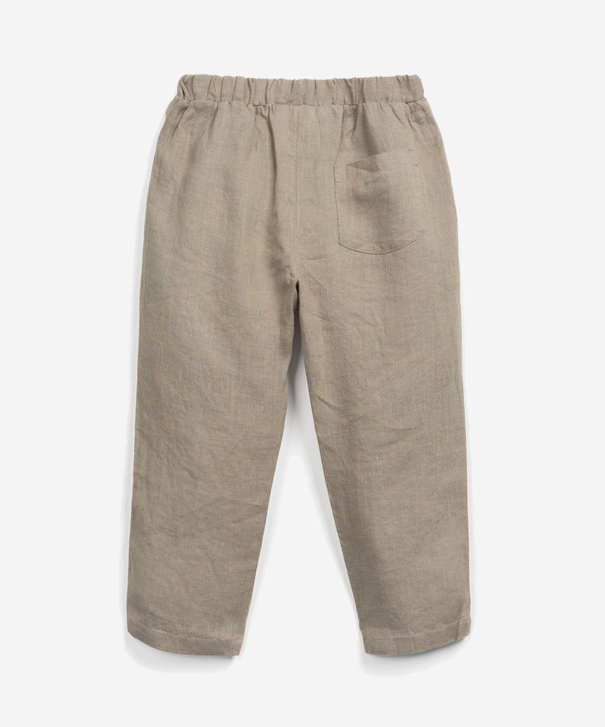 Details: These woven trousers are made of linen, Manual colour. It has an elastic waistband, a decorative coconut button, a detail on the knees, front pockets and a rear pocket.  Colour: Manual mocca  Composition:  100.0% Linen  