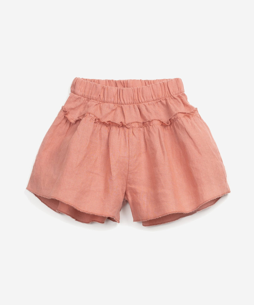 Details: These shorts are made of linen, Coral colour. This model has an elastic waist and a frill detail on the hip.  Colour: Coral   Composition:  100.0% Linen 