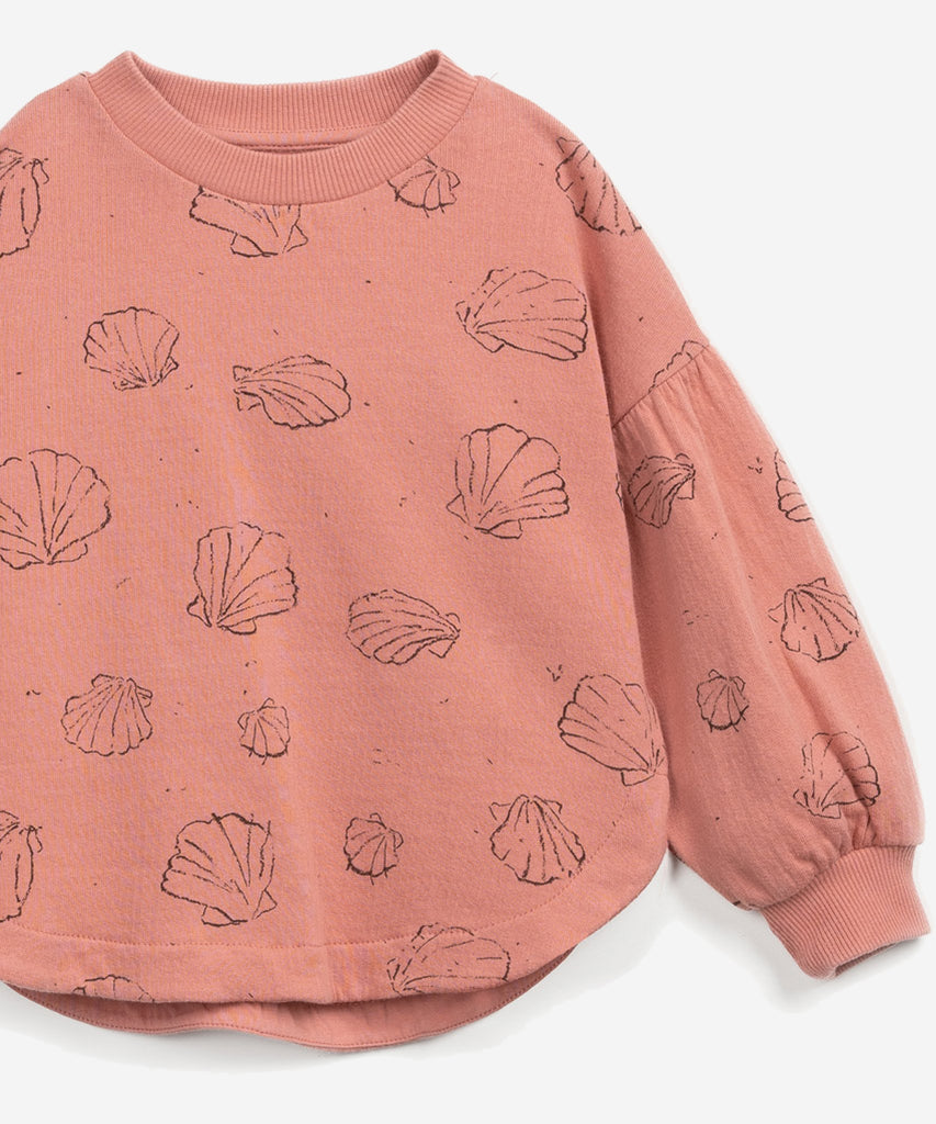Details: This jersey-stitch sweater is made from organic cotton, Coral colour. This model has a rounded fit and balloon sleeves, with elastic cuffs and our seashell print.  Colour: Coral  Composition:  98.0% Organic Cotton,2.0% Elastane  