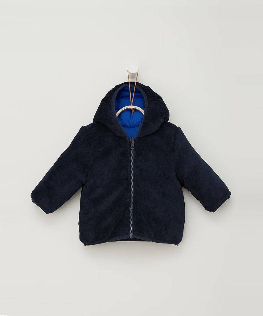 Details:  Ombre blue reversible winter jacket with zip closure. Pockets and water repellent.  Color: Ombre blue  Composition: 100% PES 
