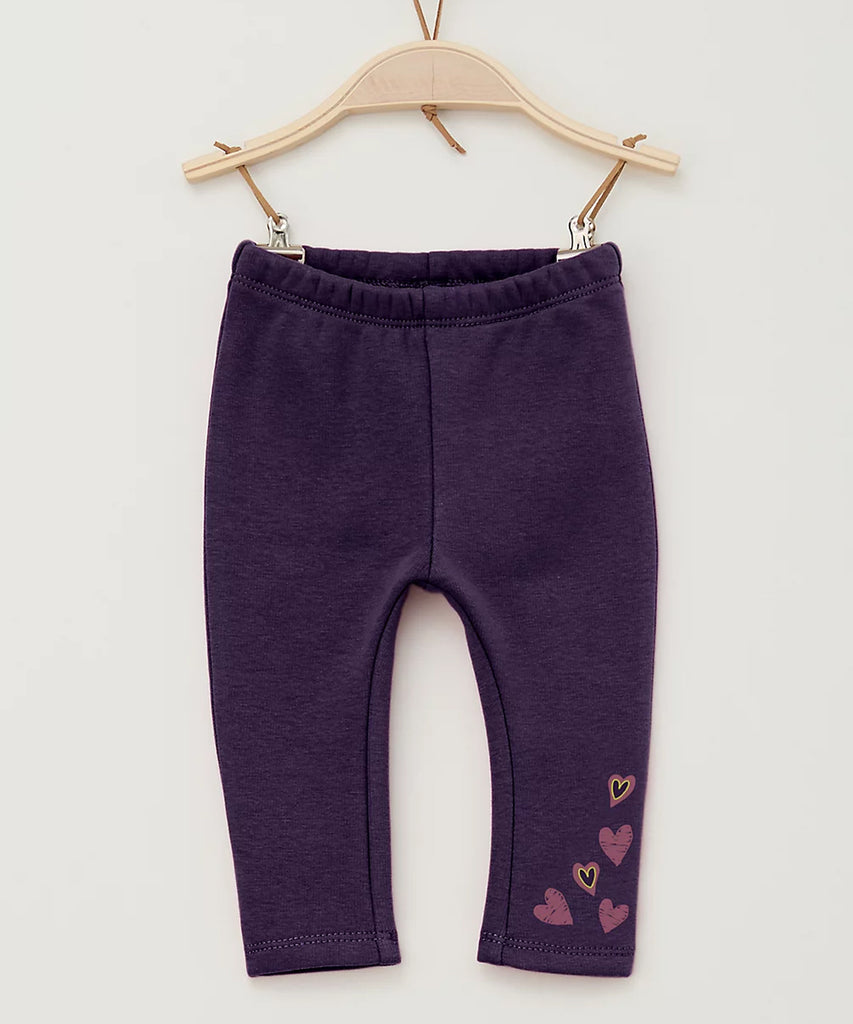 Details:  Baby will be comfortable and cozy with these warm heart leggings. Crafted with fleece lining and an elasticated waistband, these leggings provide a snug and secure fit, making them perfect for keeping little ones warm in cooler months.  Color: Dark purple  Composition:  066%PES 030%CO 004%EL  