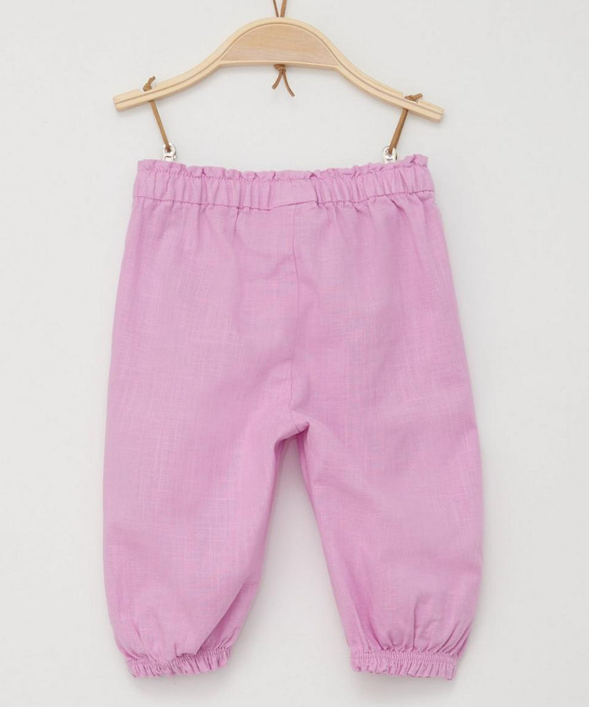 <strong>Details:</strong>&nbsp;Crafted with a delicate woven design in a charming rose color, these baby pants are both stylish and comfortable. With an elastic waistband, your little one can move freely and comfortably throughout the day. Perfect for newborns and infants, these pants are a must-have addition to any baby's wardrobe.<br><strong>Color:</strong><span> Rose&nbsp;</span><br><strong>Composition:</strong><span>&nbsp; 100%CO &nbsp;</span>