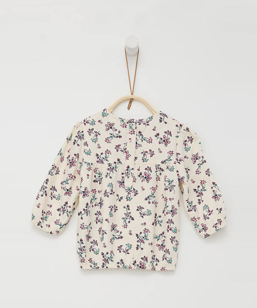 Details: Long sleeve blouse with all over print flowers. Round neckline.  Color: Cream  Composition: 100%CV   