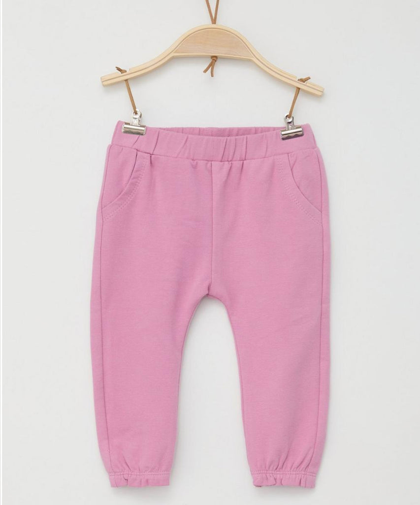Details:  The Baby Jogg Pants in Dark Rose provide both comfort and style for your little one. With an elastic waistband, these pants are perfect for active babies and provide easy dressing and movement. Keep your baby looking cute and feeling comfortable all day long.  Color: Dark rose  Composition:  095%CO 005%EL  