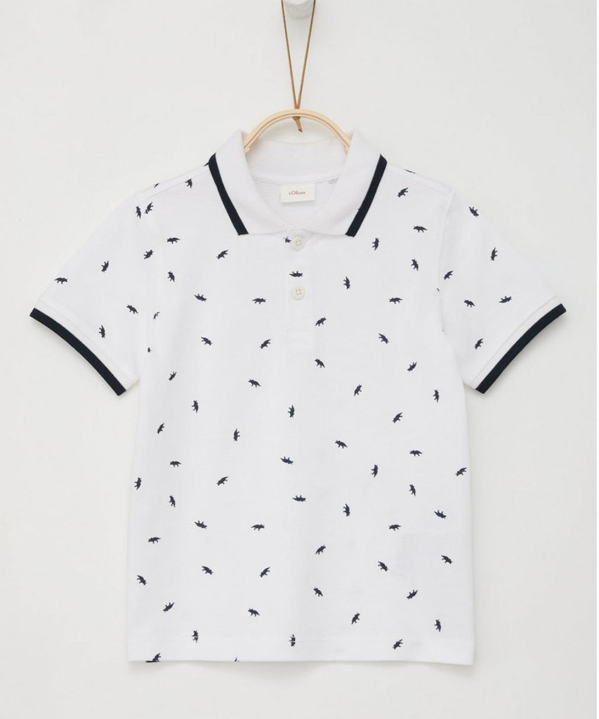 Details:  This white polo t-shirt is a must-have for any young boy's wardrobe. With its short sleeves and all-over print of dinosaurs, it combines style and comfort. Perfect for any casual or semi-formal occasion, this polo is a versatile choice that will surely impress.  Color: White  Composition: 100%CO  