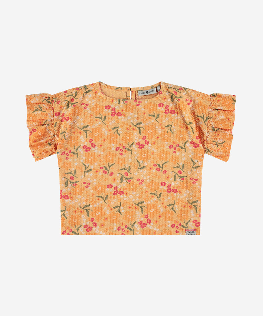 <strong>Details</strong>: Expertly crafted, this woven T-shirt features an all-over print of delicate flowers that adds a touch of whimsy to any outfit. The button closure at the back ensures a secure fit, while the short sleeves provide comfort and versatility. Elevate your wardrobe with this stylish and unique piece.&nbsp;<br><strong>Color</strong>: Cantaloupe&nbsp;<br><strong>Composition</strong>: Summer 24 &nbsp;