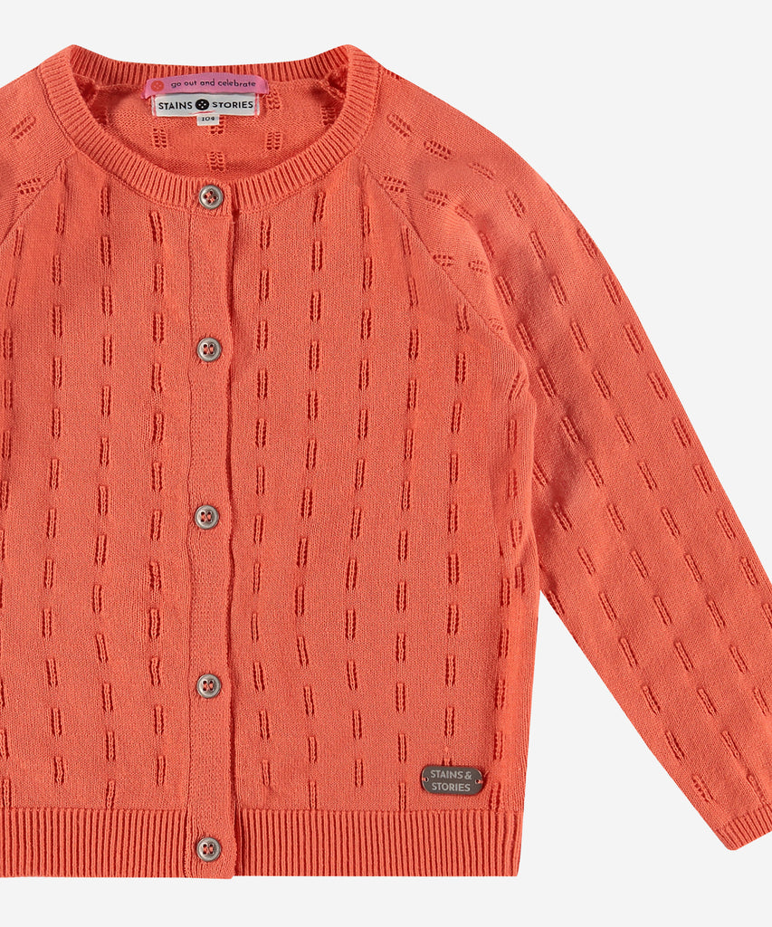 Details: This pattern knit cardigan in grapefruit color is a must-have for any fashion-forward individual. Made with a cozy design, it is both stylish and comfortable. The button closure ensures a secure fit while adding a touch of elegance. Perfect for any occasion, this cardigan is sure to elevate your  wardrobe.  Color: Grapefruit  Composition: 100% cotton  