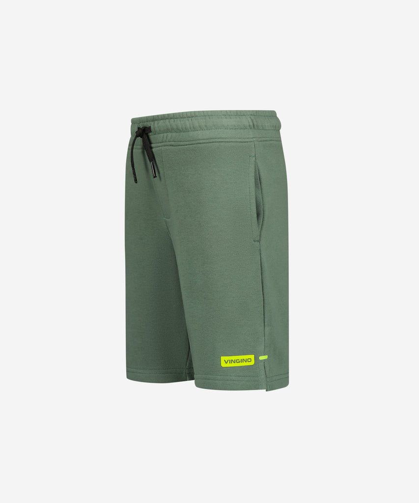 Details:  Expertly designed for maximum comfort and style, our Basic Jogg Shorts in Biome Green are the perfect addition to any wardrobe. Crafted with an elastic waistband and convenient pockets, these sweat shorts offer both functionality and ease. Stay comfortable and on-trend with our versatile green shorts.  Color:  Green  Composition:  80% Cotton / 20% Polyester  
