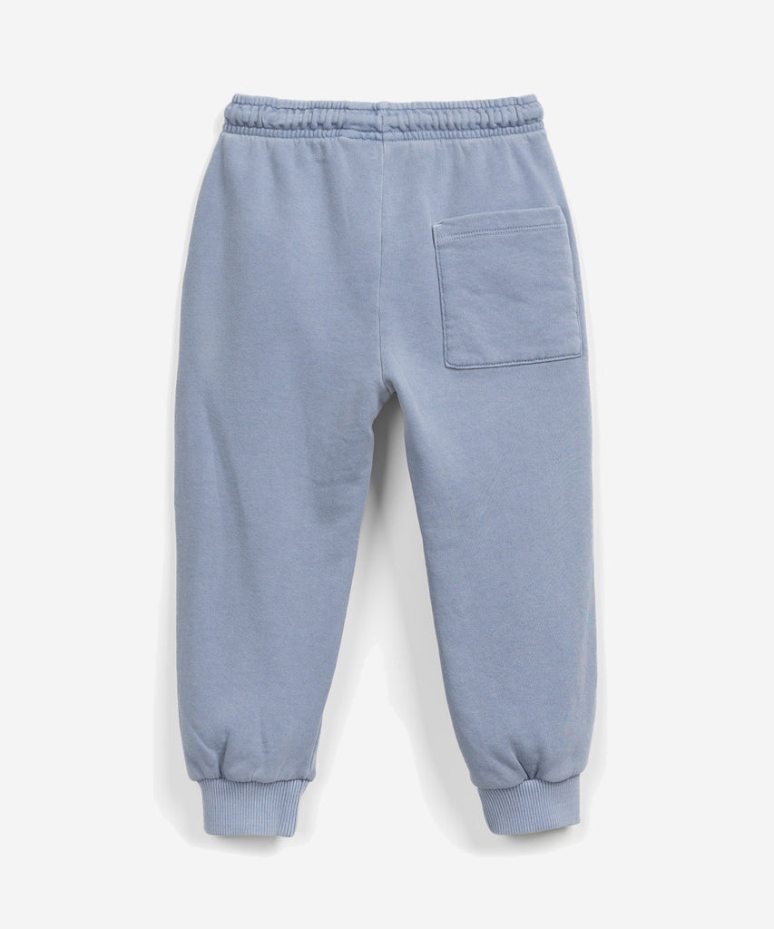 Details: These fleece trousers are made of a mixture of organic cotton and cotton, Sea colour. This model has an elastic waist and adjustable drawstring, front pockets and a rear pocket.  Colour: Sea blue  Composition:  70.0% Organic Cotton,30.0% Cotton  