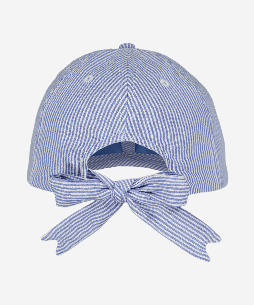 Details: The Flamingo Cap is a lined, cotton cap with a bow tie closure at the back for an adjustable fit.  Sizing:  50cm - Age: 1,5-3Y  53cm - Age: 4-8Y  Color: blue white  Composition: 85% Cotton 15% Polyester 