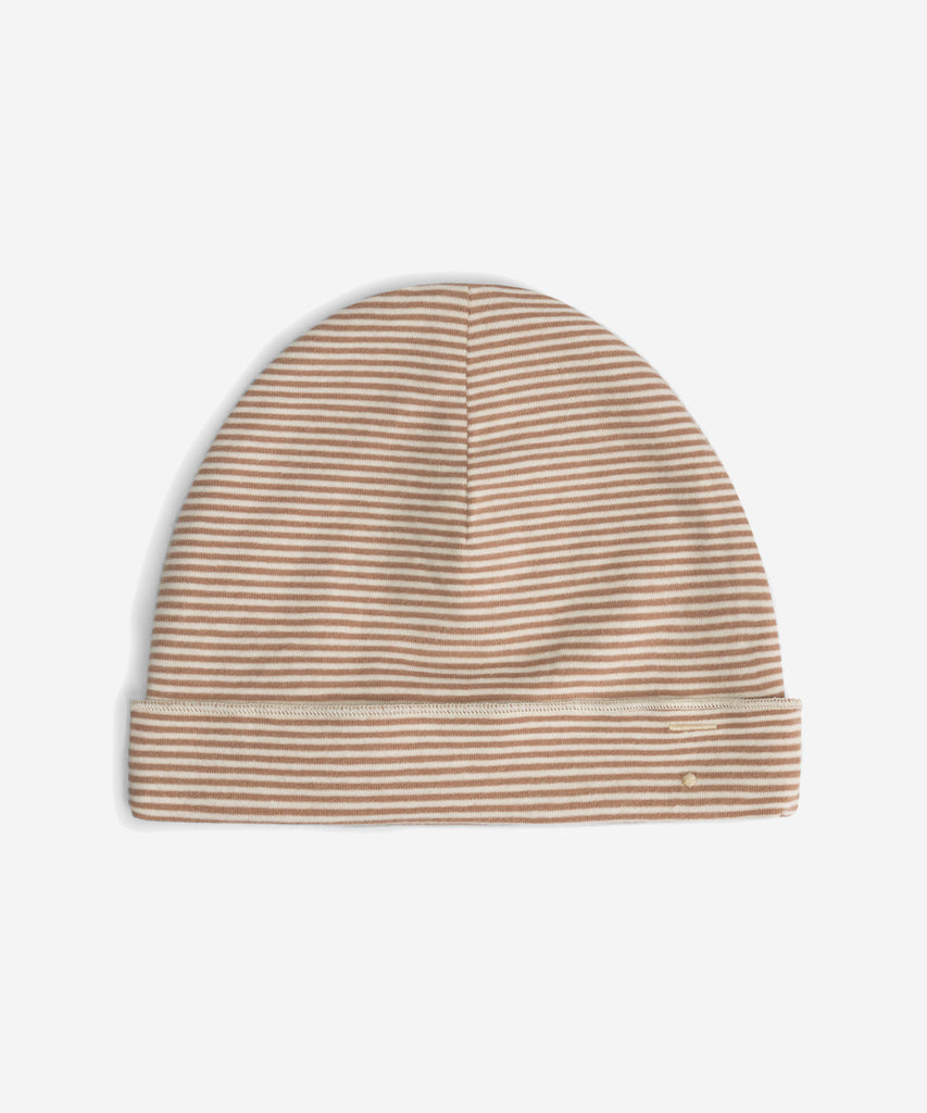 Details: Fitting comfortably over the head, this beanie offers lightweight protection from the cold. Made from the softest organic cotton rib, it has a folded brim and a herringbone detail on the sides.  Color: Biscuit  Composition: 95% Organic Cotton Jersey, 5% Elastane Rib  Made in Portugal