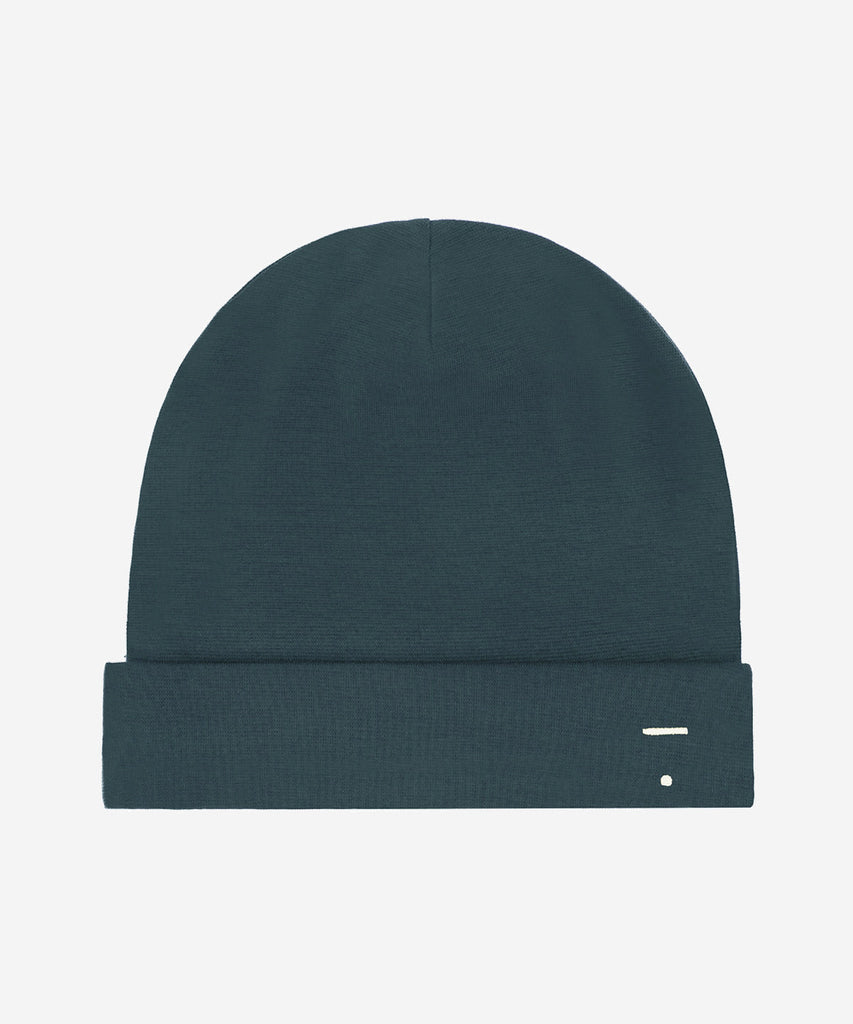 Details: Fitting comfortably over the head, this beanie offers lightweight protection from the cold. Made from the softest organic cotton rib, it has a folded brim and a herringbone detail on the sides.  Color: Blue Grey  Composition: 96% Organic Cotton Jersey, 4% Elastane Rib  Made in Portugal