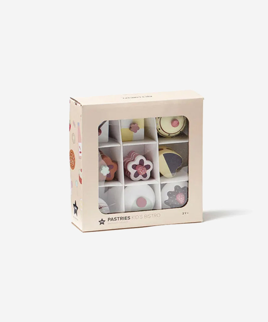 Kid's Concept  Deliciously designed wooden play pastries. Invite all our best friends for an afternoon tea party.  Age: 3y+  Size: 9 pastry pieces.  Color: Multi pastel  Composition: Shima, mdf, plywood. 
