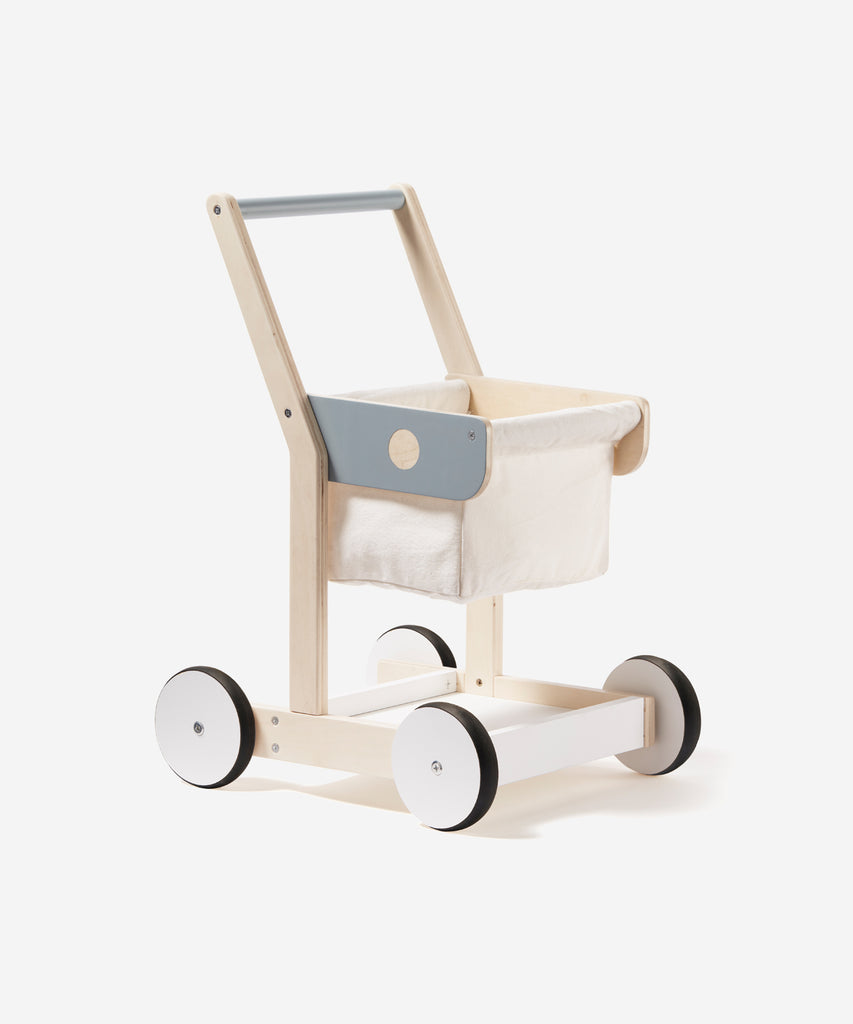 Kid's Concept  A wooden shopping trolley with 100% cotton storage. A great role play toy that encourages mobility and is the perfect addition to any child’s play shop. Use both the upper basket and lower tray to collect groceries as you wander the isles!  Age: 2y+  Size: 36 x 28.5 x 50cm