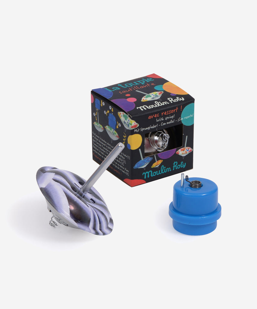 MOULIN ROTY  This spinning top has a built-in spring so it spins and bounces at the same time!  Collection's history Les Petites Merveilles... Little nothings for big play; invent a thousand and one different marvels …  Age: 3+ Color: dark violet Size: 6cm Composition: metal & plastic