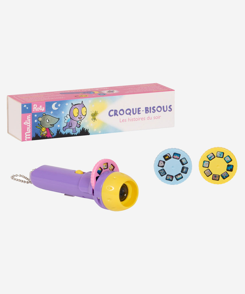 MOULIN ROTY   École des Loisirs "Croque-Bisous" Storybook Torch  Pocket torch with 3 disks to project on the wall, each telling the adventures of Croque-Bisous, star of the L'École des Loisirs books. To help little ones drift off to sleep and develop their imagination.
