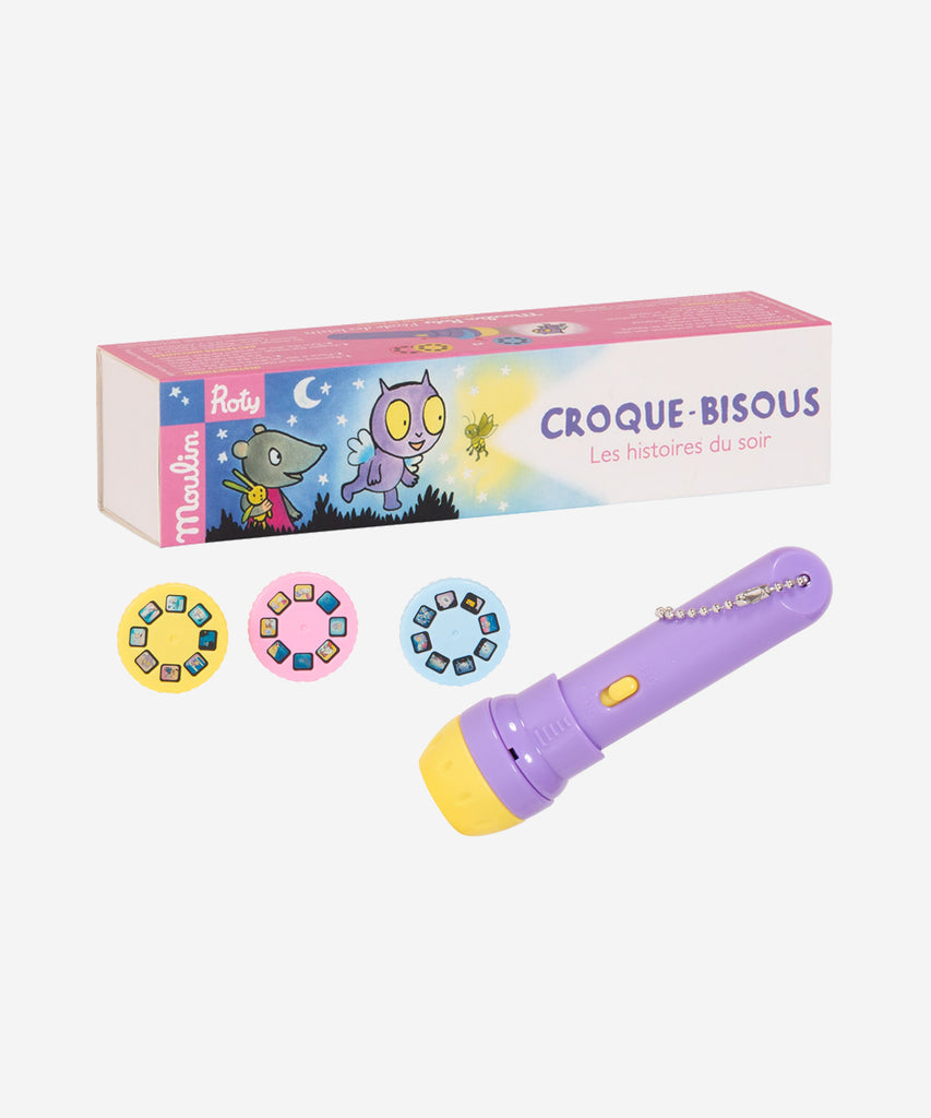 MOULIN ROTY   École des Loisirs "Croque-Bisous" Storybook Torch  Pocket torch with 3 disks to project on the wall, each telling the adventures of Croque-Bisous, star of the L'École des Loisirs books. To help little ones drift off to sleep and develop their imagination.