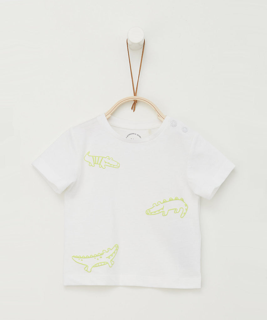 Details: Short sleeve t-shirt with crocodiles print. Round neckline. Pushbuttons on shoulder for easy on and off.   Color: White  Composition: CO100%   