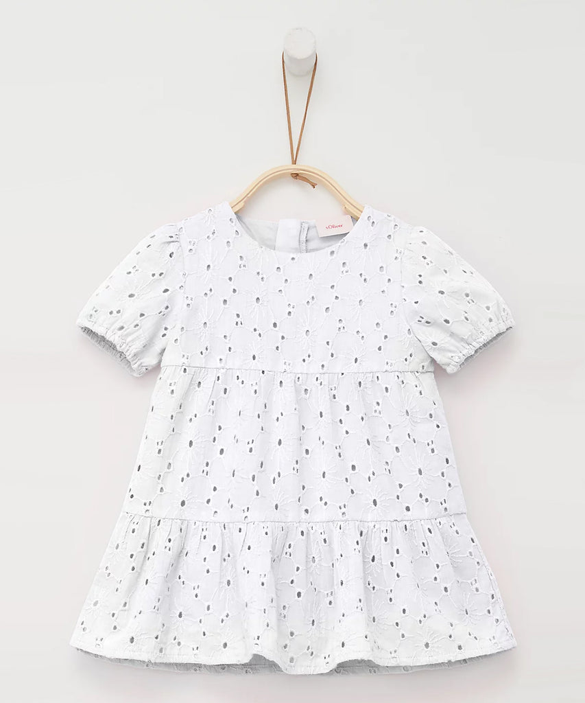 Details:  Short sleeve dress with broderie anglaise. Round neckline.  Color: White  Composition:  CO100% 