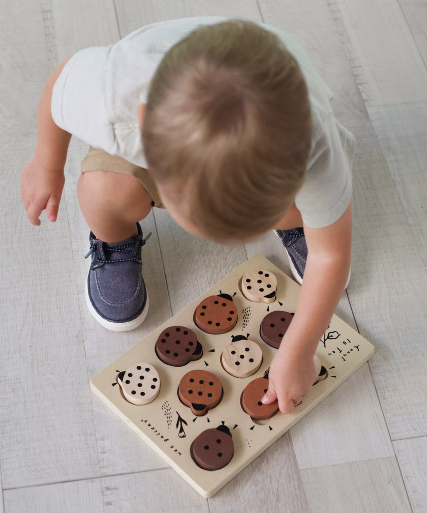 Wee Gallery  This beautiful wooden puzzle is a fun and challenging way to explore numbers! As counting skills improve, children will be able to solve the puzzle by matching the numbers to the dots on the ladybugs.  