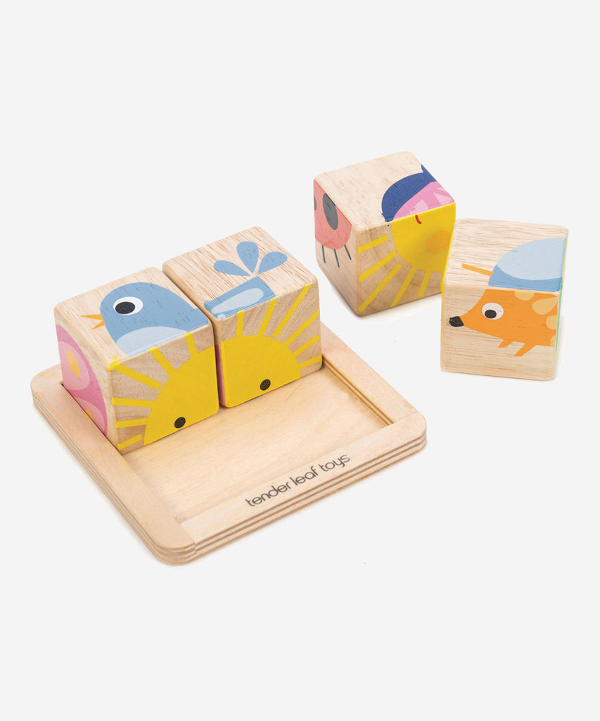 Tender Leaf®  This simple, four piece block is illustrated with warm bright colors and simple graphics. Challenge your toddler to create 4 different animal pictures using the tray to keep them safe.  A fantastic first toy for your toddler, as it helps to develop hand eye coordination, spatial thinking, and concentration.   Includes: 4 wooden blocks t create 6 different pictures  Age: 18M +  Size: 10.5 x 10.5 x 4.5cm
